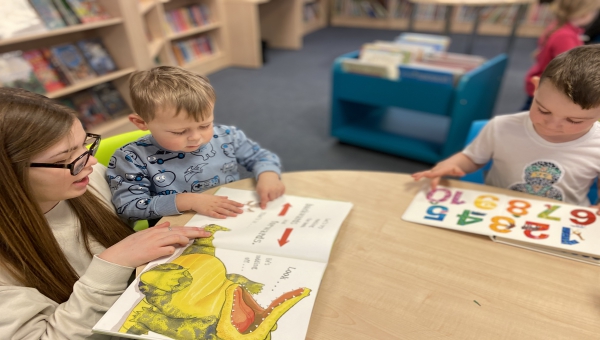 Children reading a picture book at Leominster Library