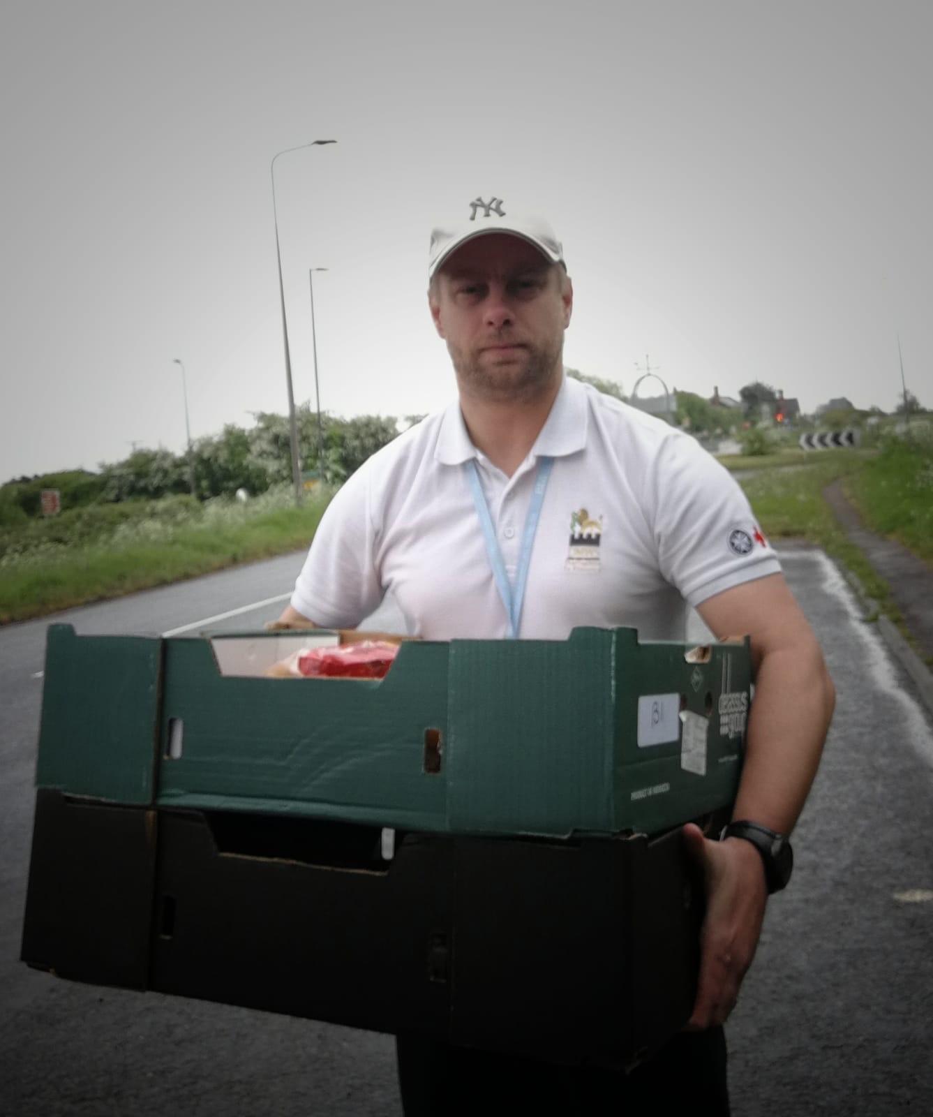 Defence Medical Welfare Service Welfare Officer Ashley Winter delivering food boxes to shielded veterans