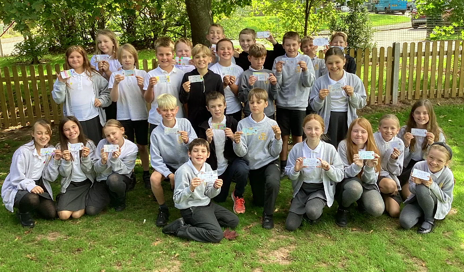 Pupils from Trinity Primary School, Hereford, hold their messages of hope