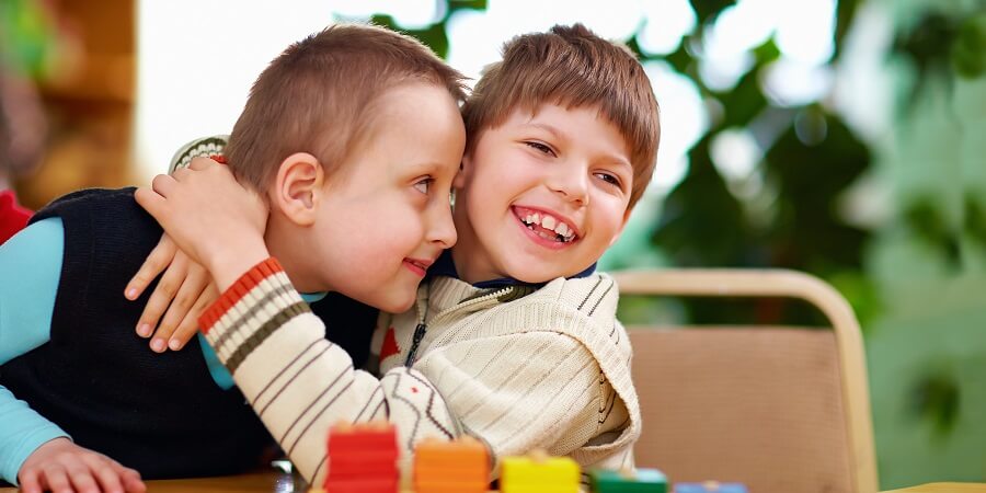 Two boys hugging