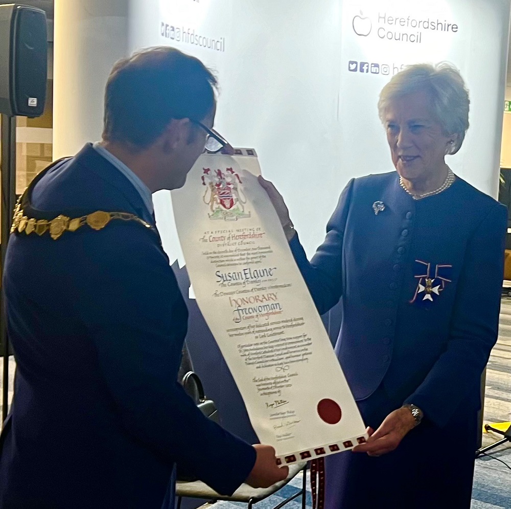Councillor Roger Phillips, Chairperson Herefordshire Council presents Lady Darnley with a scroll.
