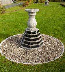 Granite sundial memorial with granite plaque