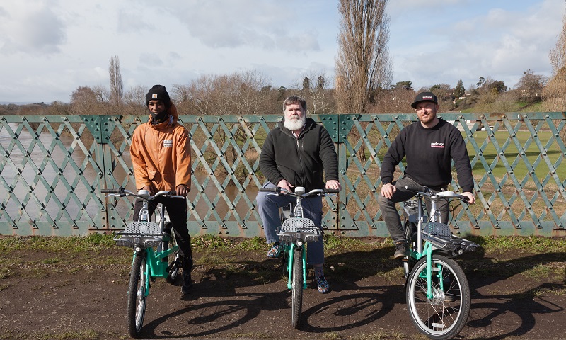 Cllr Harrington and two members of Pedicargo with the new Beryl e-bike on Hunderton Bridge, Hereford