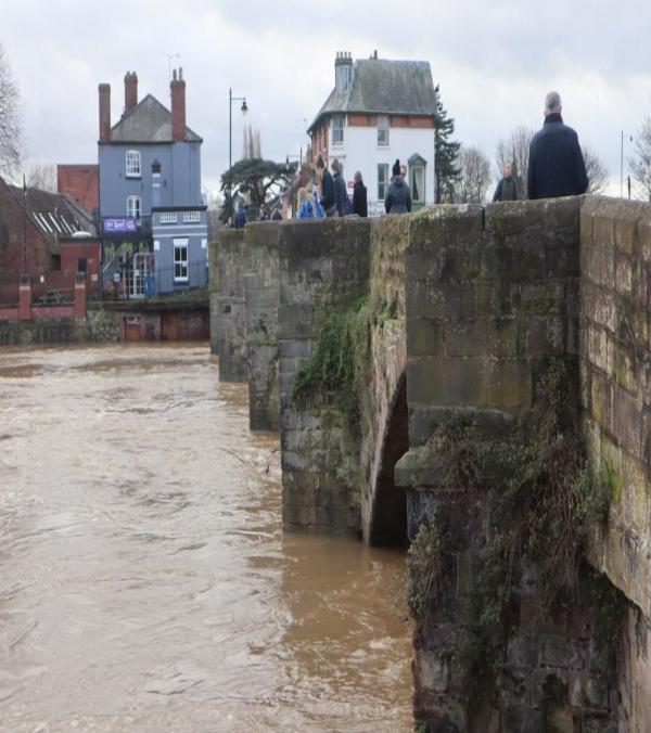old bridge hereford with very high river level nearly to top of arches