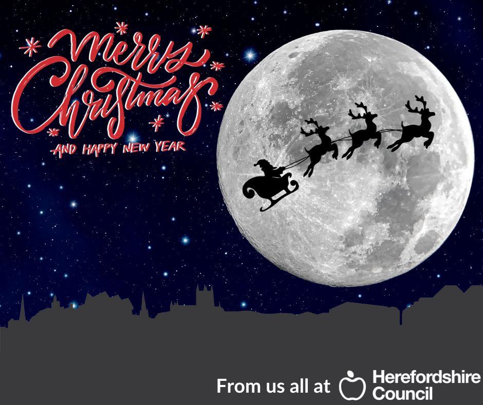 Moon with Santa flying past over a silhouette of Herefordshire landmarks with text Merry Christms and a Happy New year from us all at Herefordshire council