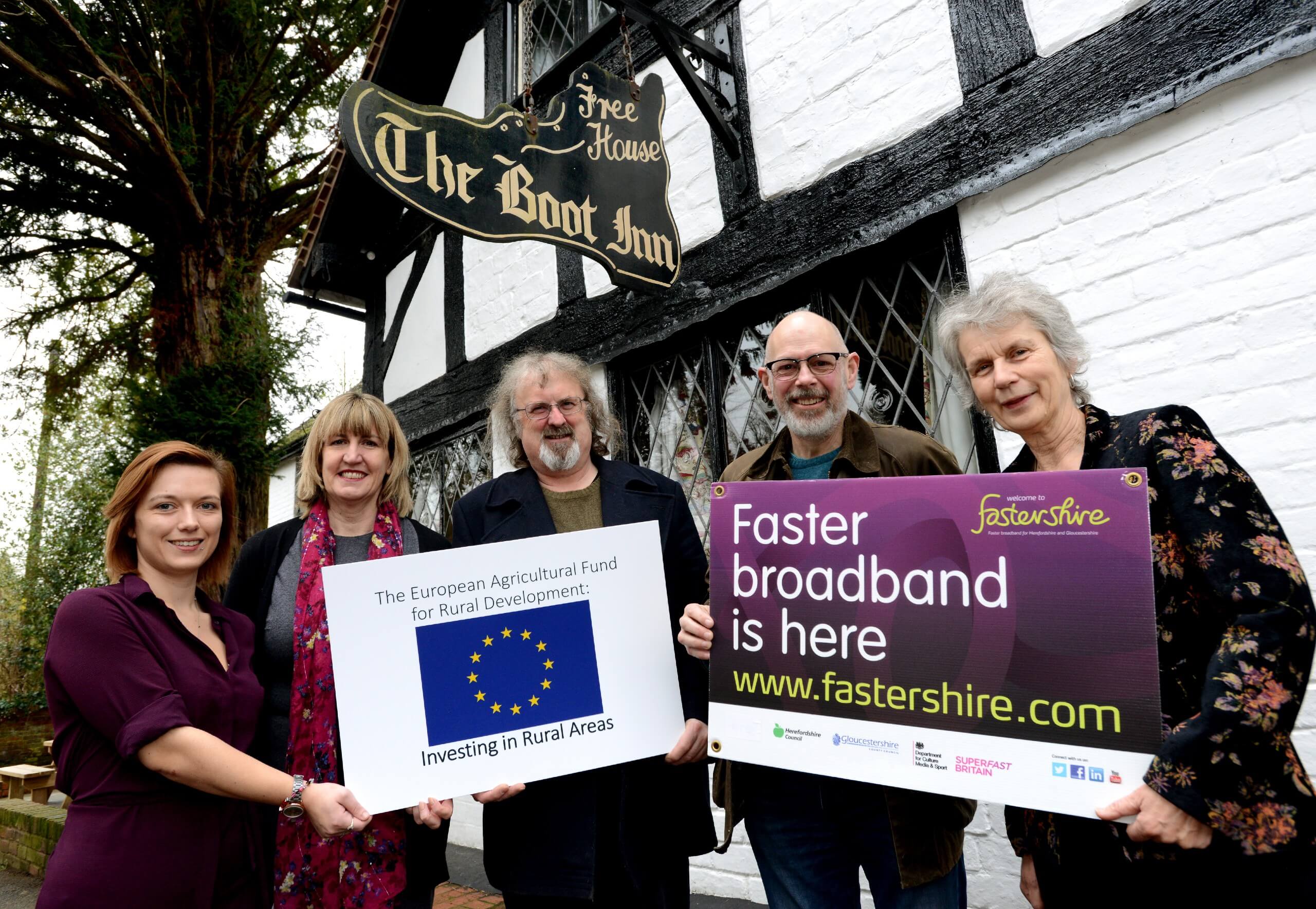 Cllr Trish Marsh [right] joined by John Alderman and David Flory from the Community Boot Inn Limited with Airband project co-ordinators, Rebecca Palmer-Gore and Anita Horne