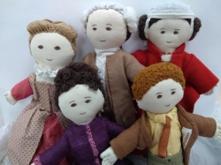 Collection of rag dolls dressed to show period costume