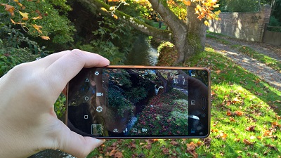 Taking a photo of a brook