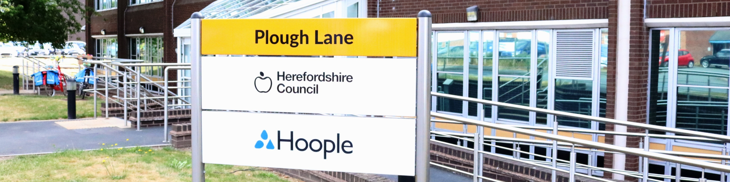 Sign which says Herefordshire Council outside the council's Plough Lane office