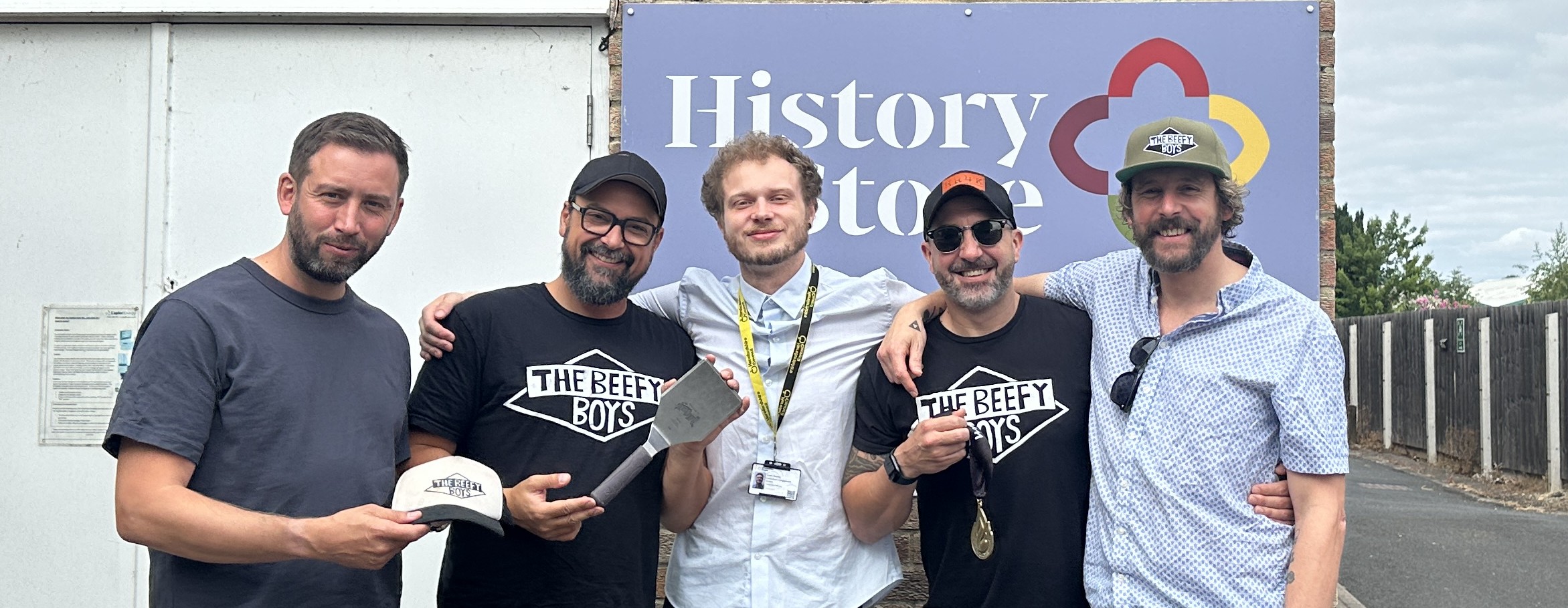 Group outside the History Store, Hereford, celebrating donation of items from The Beefy Boys, Hereford