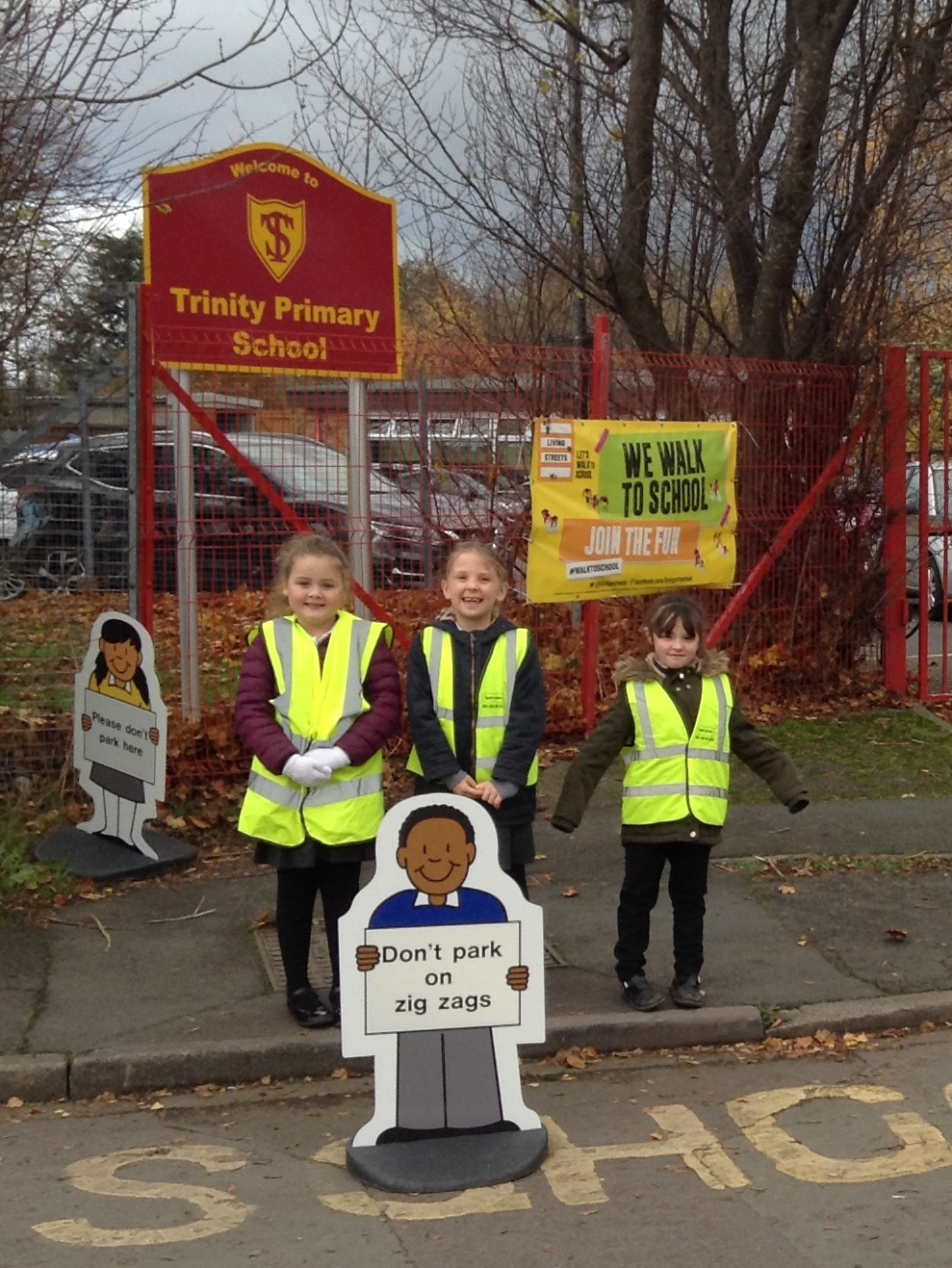 Children outside Trinity School learning about road safety week