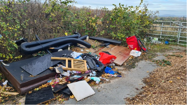 Ugly pile of rubbish tipped illegally at a gateway in Rotherwas