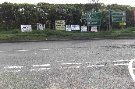 Signs on highway verge at A438 A411 Willersley junction