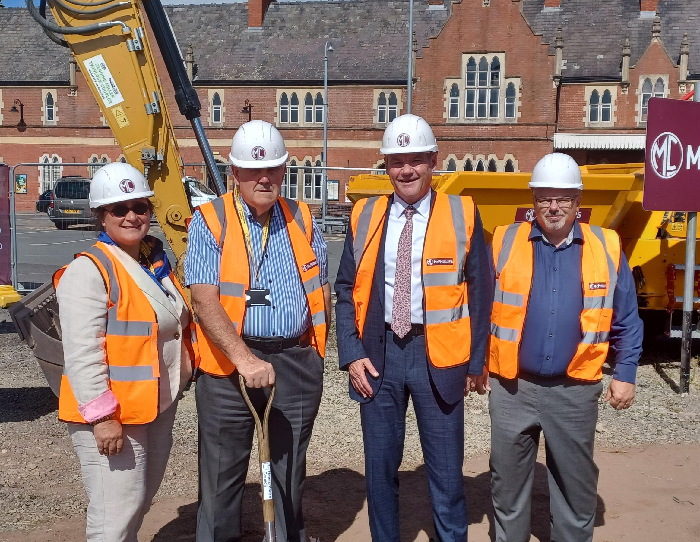 Photo of Cllr Elissa Swinglehurst, Cabinet Member for the Environment and Deputy Leader of Herefordshire Council, Cllr Philip Price, Cabinet Member for Transport and Infrastructure, Paul Walker, Herefordshire Council’s Chief Executive, Scott Tompkins, Herefordshire Council’s Delivery Director for Infrastructure, at the site of Hereford’s new Transport Hub.