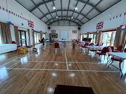 Tables set up inside Upton Bishop Millennium Hall