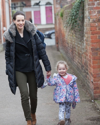 Mother and child walking to school