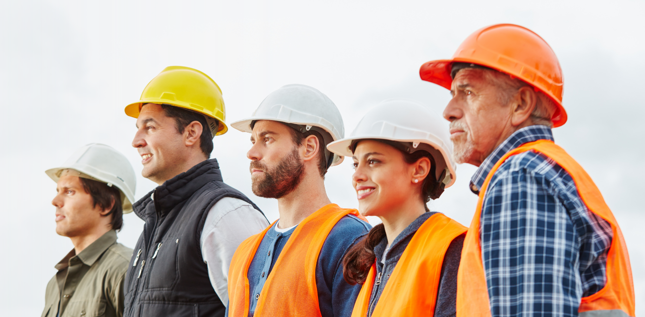 Five construction workers in hard hats