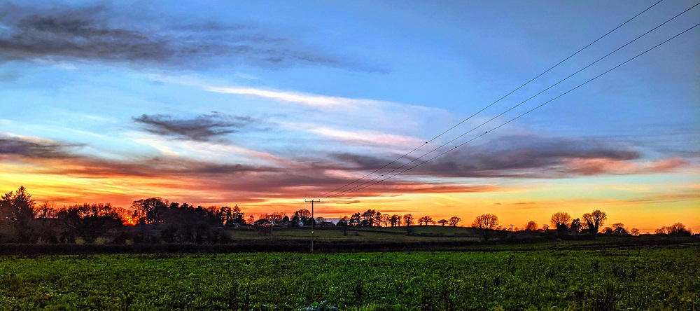 Sunset landscape with pylons
