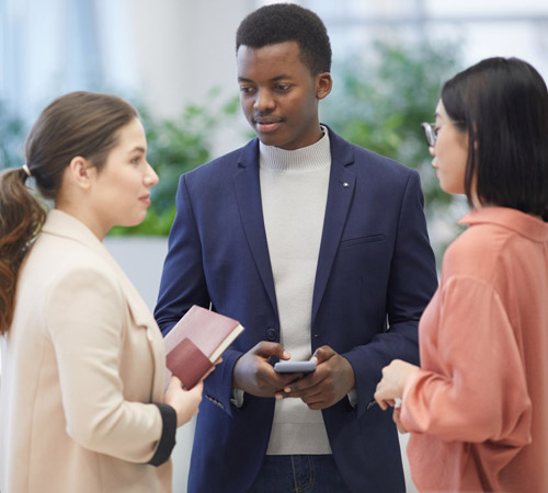 Group of young business people talking